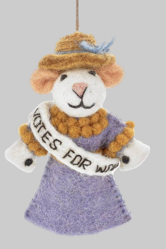 Knitted ornament of a woman in a suffrage dress with a banner on a gray background