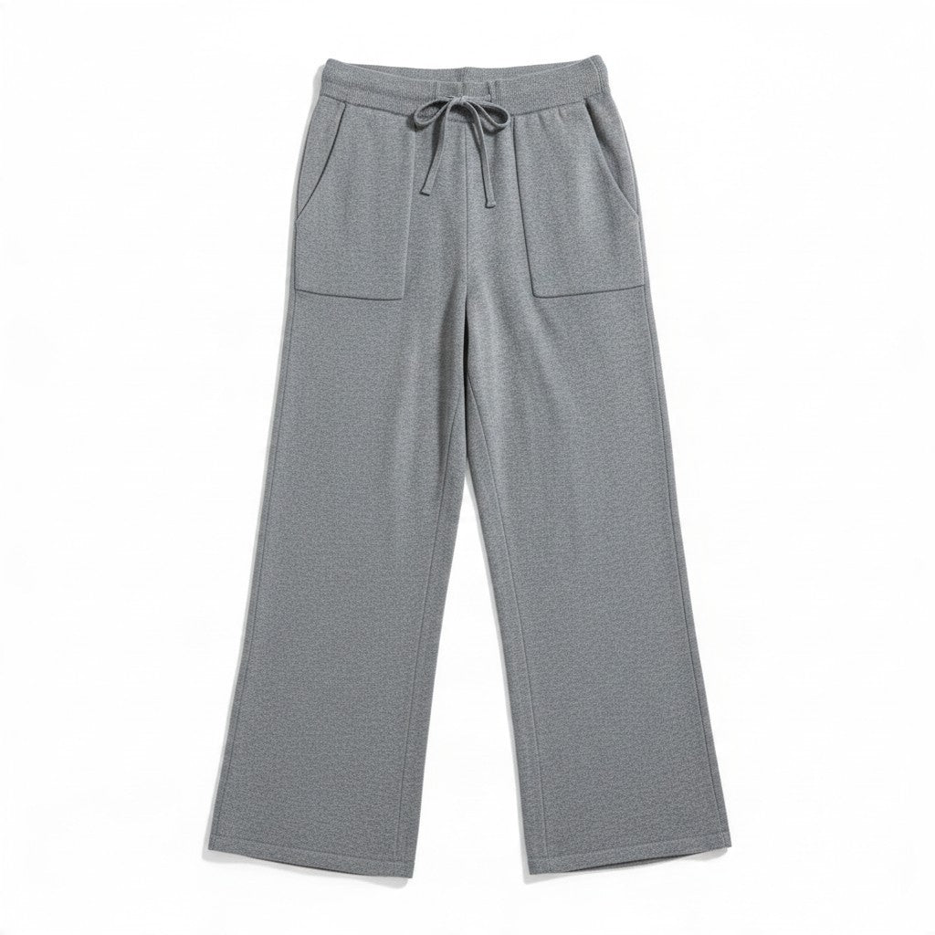 Natural Clothing Company Polita grey cotton lounge pants with a wide leg, drawstring waist, and front patch pockets.