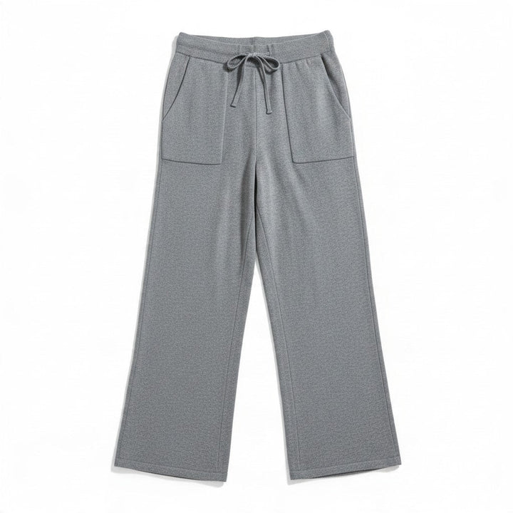 Natural Clothing Company Polita grey cotton lounge pants with a wide leg, drawstring waist, and front patch pockets.