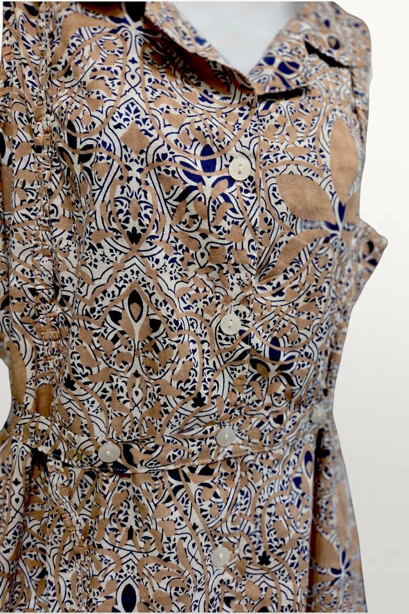 Natural Clothing Company sleeveless cotton summer dress in a tan and navy printed pattern with a button-down front.